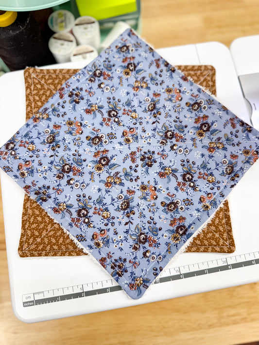Floral fabric on a cutting mat with a ruler