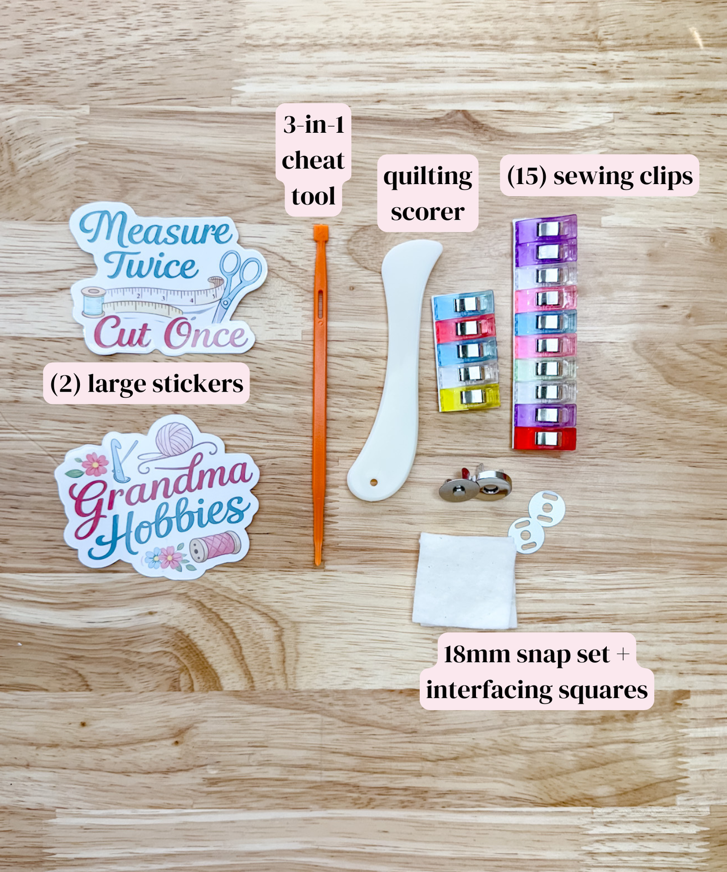 Collection of sewing tools and accessories on a wooden surface