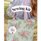 A person outdoors wearing a gray sweatshirt and carrying a floral tote bag with pink straps. A white label says 'Sewing Kit' and another circular badge says 'PDF & VIDEO'.