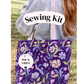 A person outdoors carrying a purple floral tote bag with a pink strap. A white banner across the top reads 'Sewing Kit' and a circular badge on the bag says 'PDF & VIDEO'.