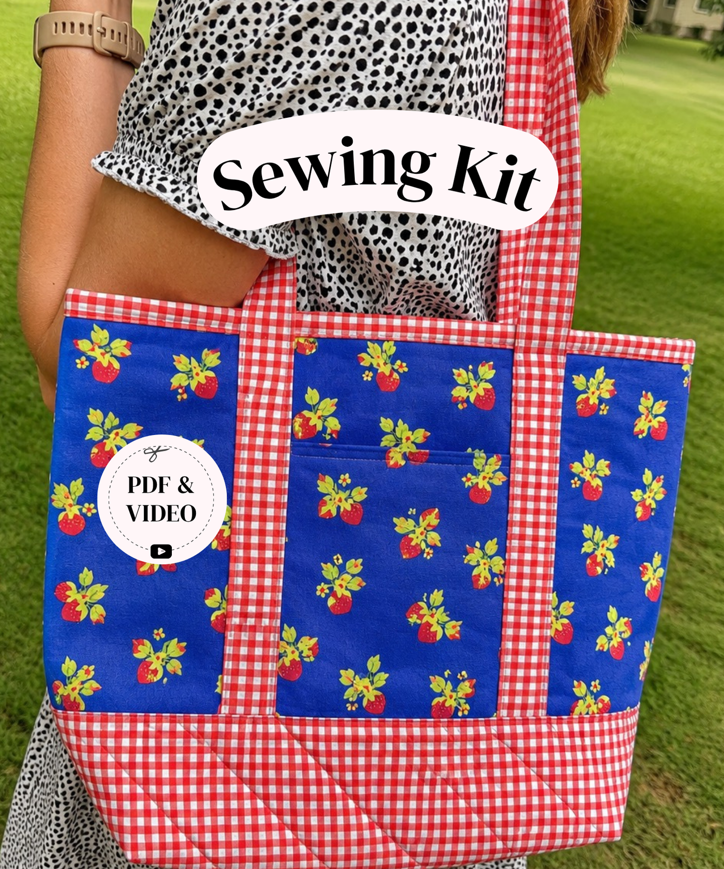 A person outdoors carrying a large fabric tote bag with red-and-white gingham trim and blue front panels printed with small red and yellow floral motifs. A white label on the bag reads 'PDF & VIDEO', and a white banner across the top says 'Sewing Kit'.