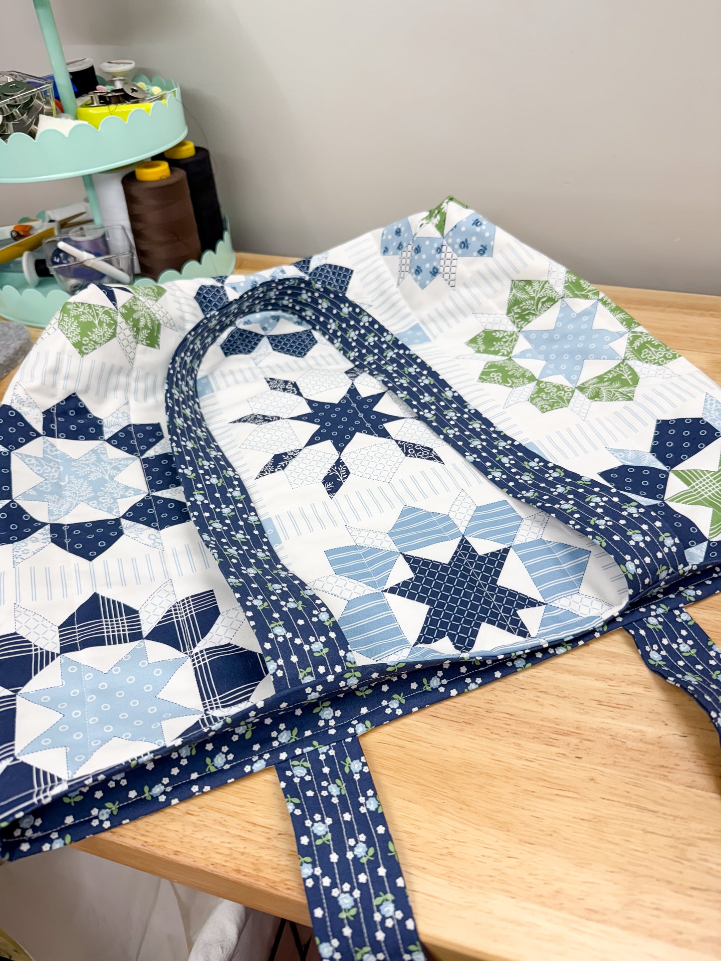 Quilt with star pattern on a wooden table