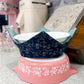 ceramic bowl in a navy blue leafy floral bowl cozy