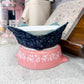 Pink and blue ceramic bowls on a countertop