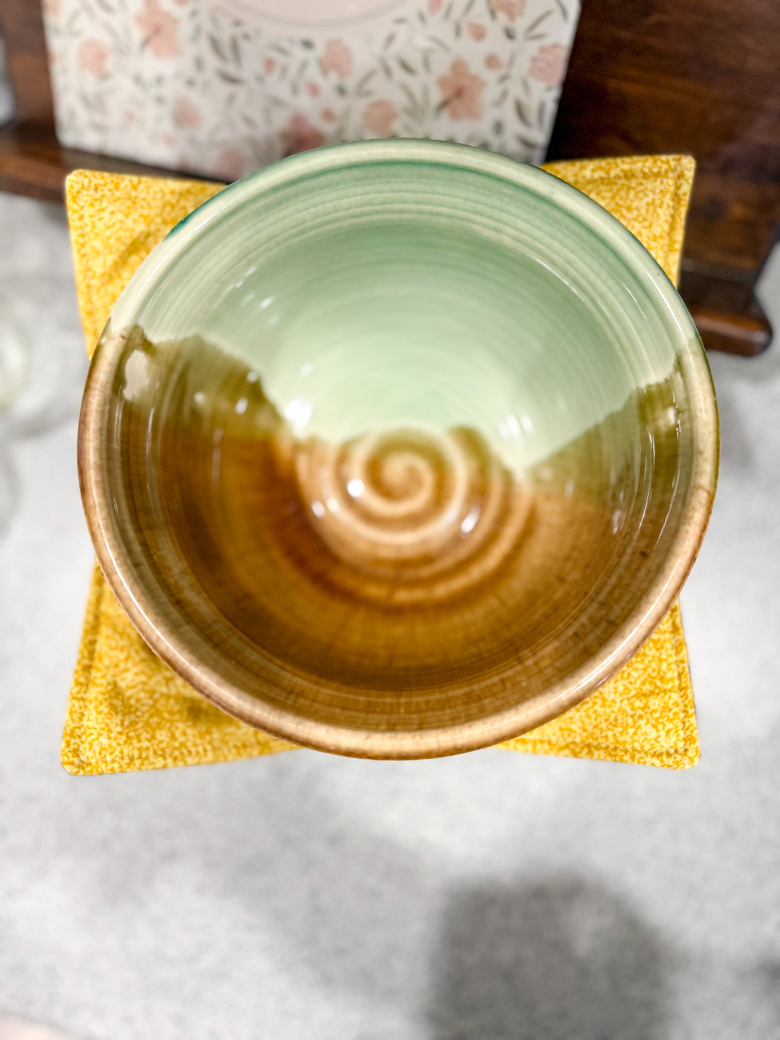 Ceramic bowl with gradient color on a yellow cloth
