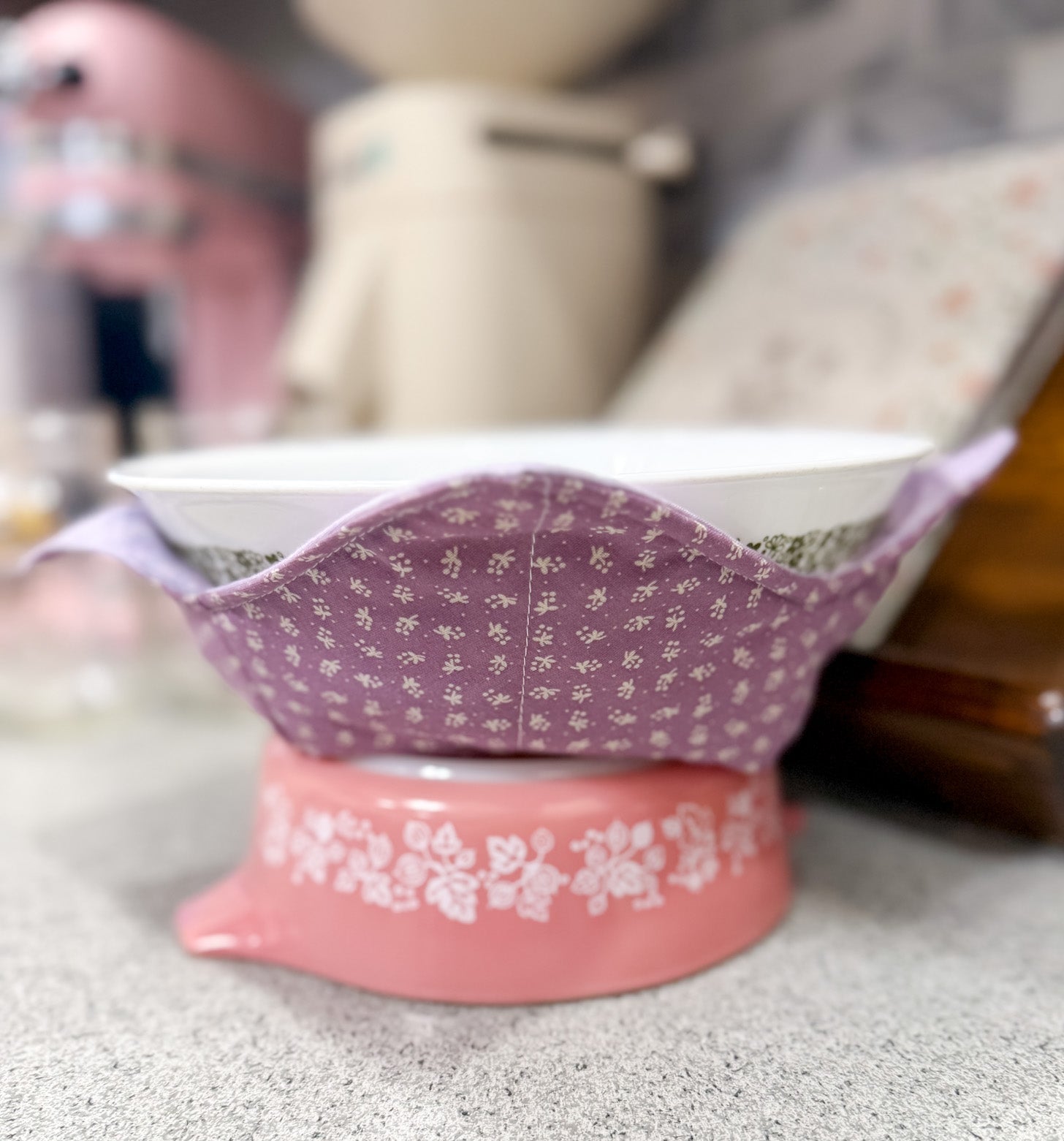 Pink and white floral-patterned dish on a gray surface