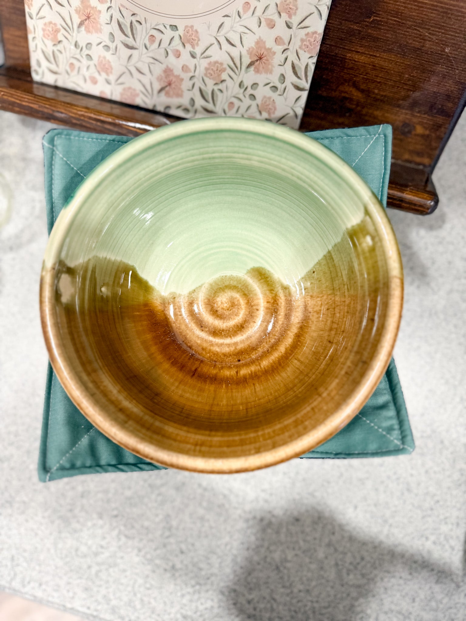 Ceramic bowl with a gradient design on a textured surface
