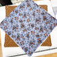 Floral fabric on a cutting mat with a ruler