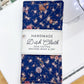 Handmade dish cloth with floral pattern on a white surface