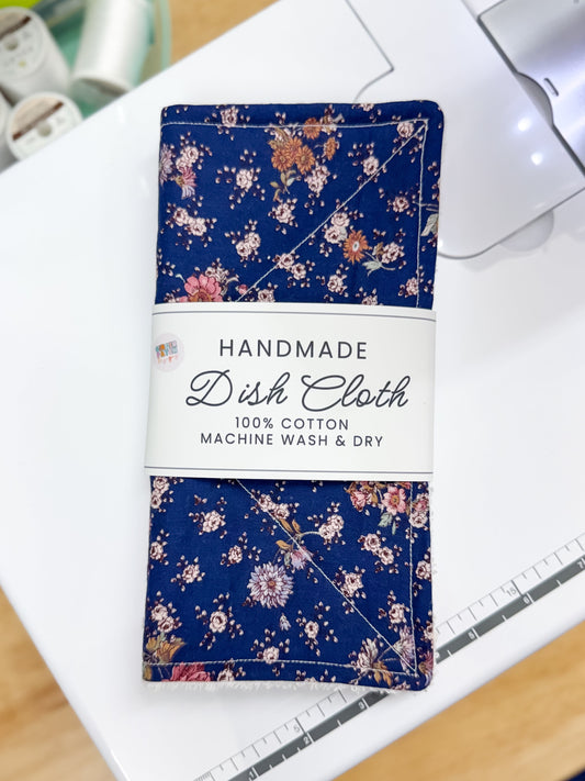 Handmade dish cloth with floral pattern on a white surface