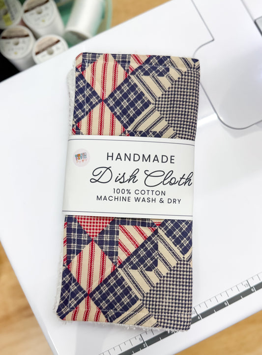 Handmade dish cloth with patchwork pattern on a white surface