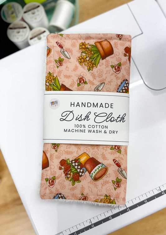 Handmade dish cloth packaging with a pattern on a white surface