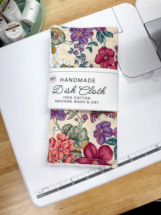 Handmade dish cloth packaging with floral design on a sewing machine