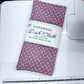 Handmade dish cloth with floral pattern on a cutting mat