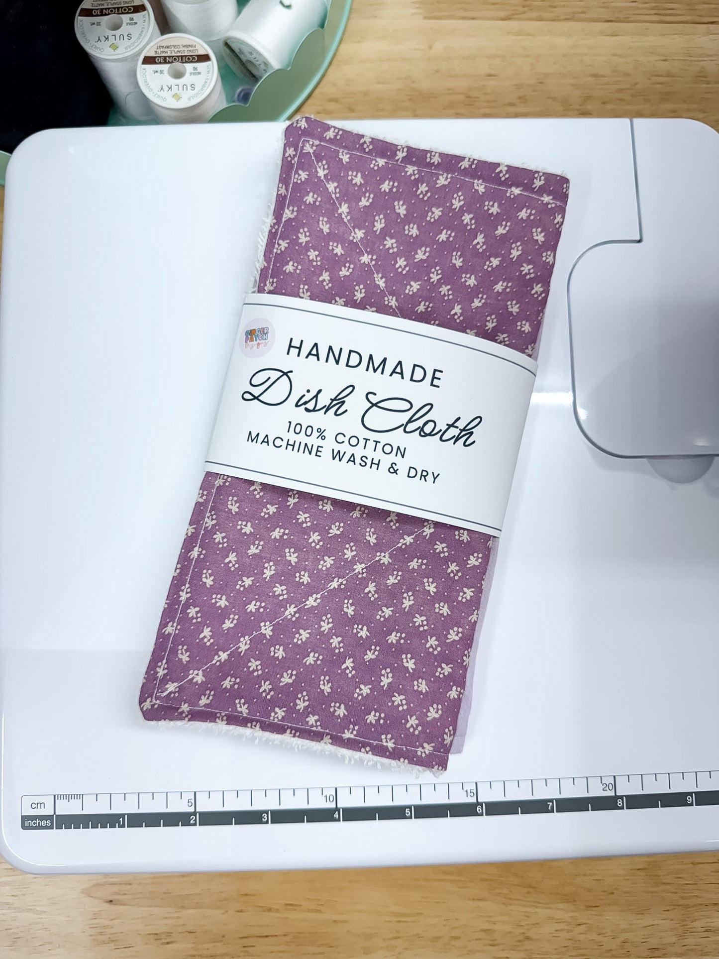 Handmade dish cloth with floral pattern on a cutting mat