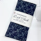 Handmade dish cloth with floral pattern on a white cutting mat