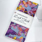 Handmade dish cloth with butterfly design on a cutting mat