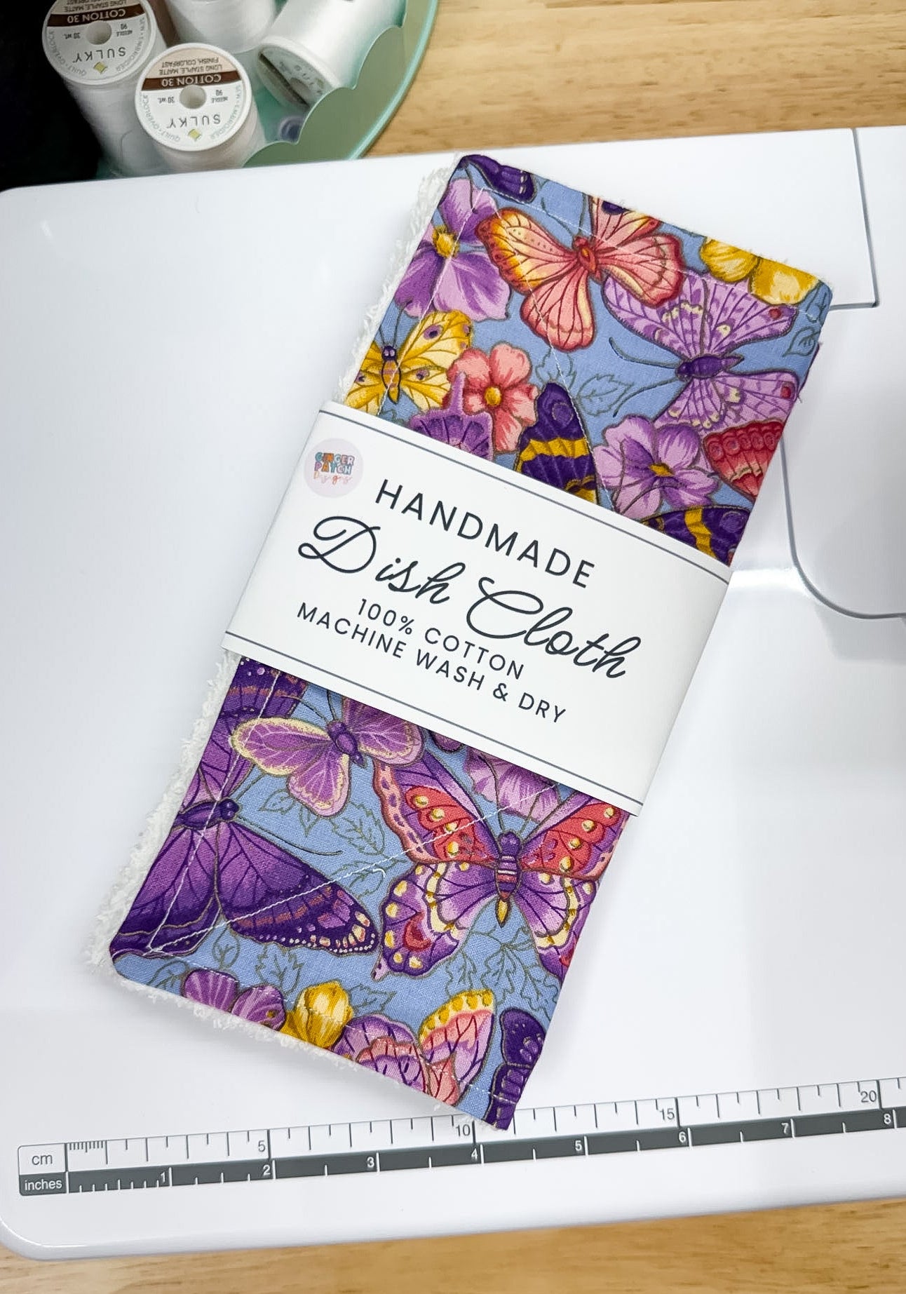 Handmade dish cloth with butterfly design on a cutting mat