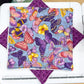 Colorful butterfly patterned fabric on a cutting mat with a ruler