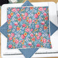 Floral fabric on a cutting mat with a ruler
