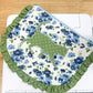 Floral fabric with green border on a cutting mat with ruler